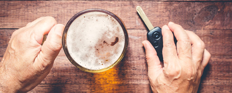 Minneapolis DWI Attorneys. Picture of man's hand holding a beer and his car keys.